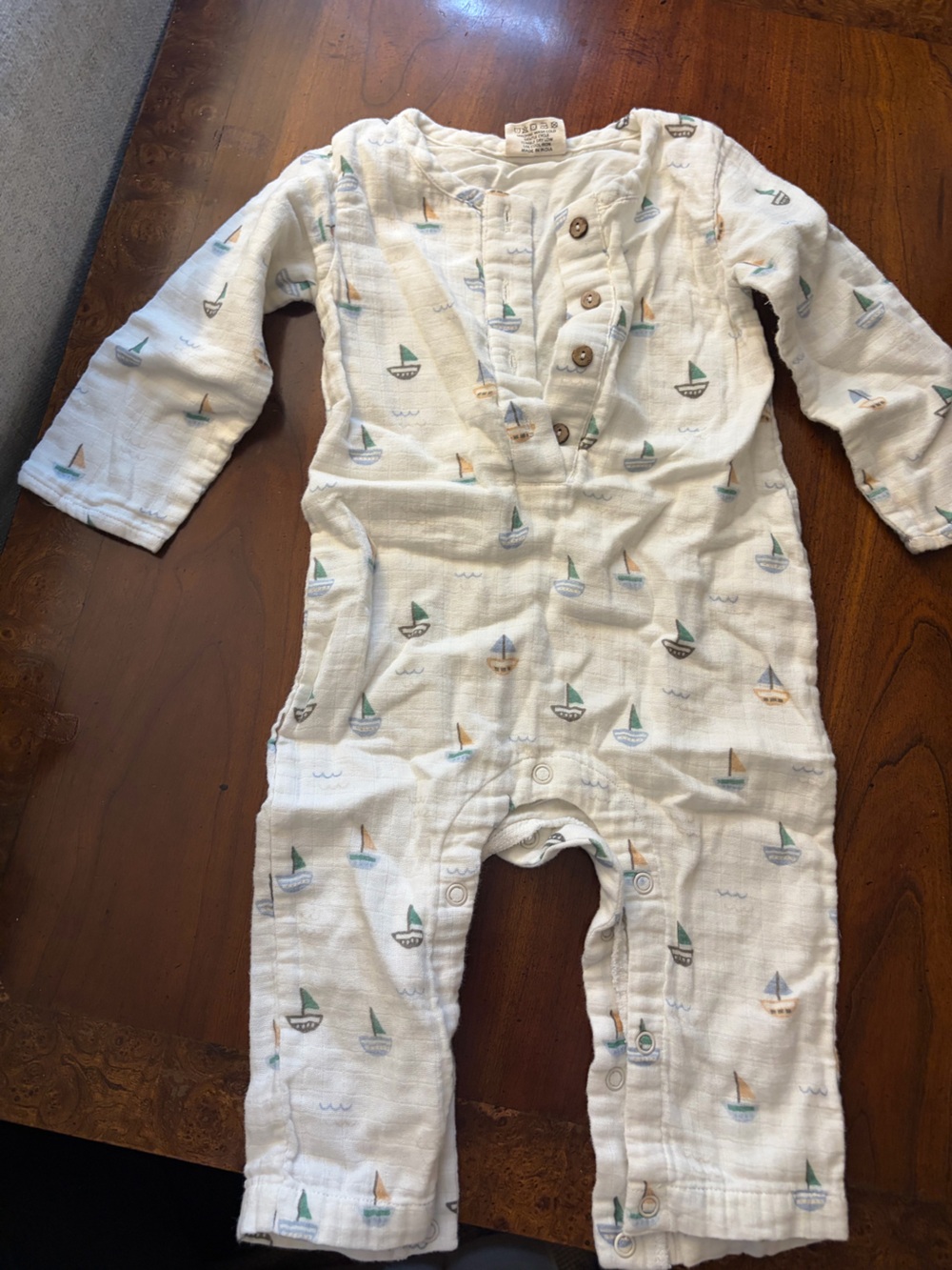 White Muslin Baby One-Piece with Multicolor Sailboat Print